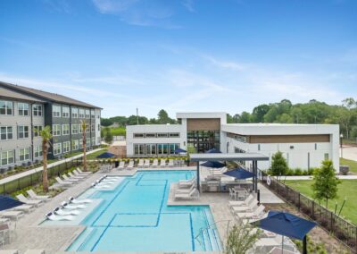Pool Shot with Exterior Clubhouse